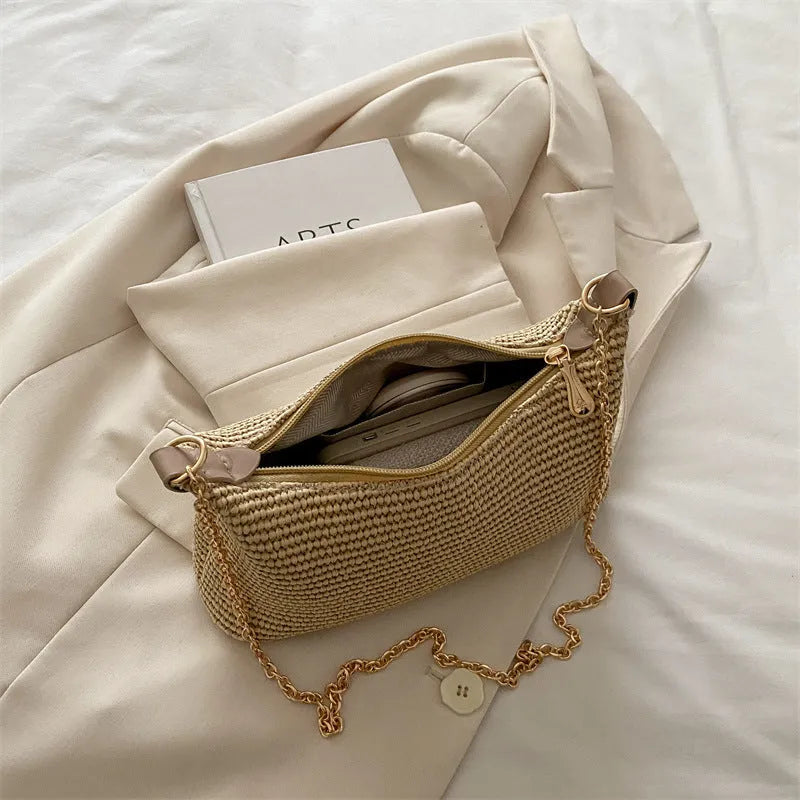 Woven straw crossbody handbag in horizontal square shape with phone compartment