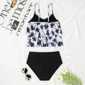 High waisted black and coconut tree print swimsuit top and bottom on a mannequin