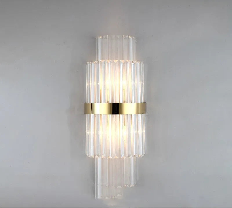 Modern crystal wall lamp with petal design and titanium gold finish mounted on wall