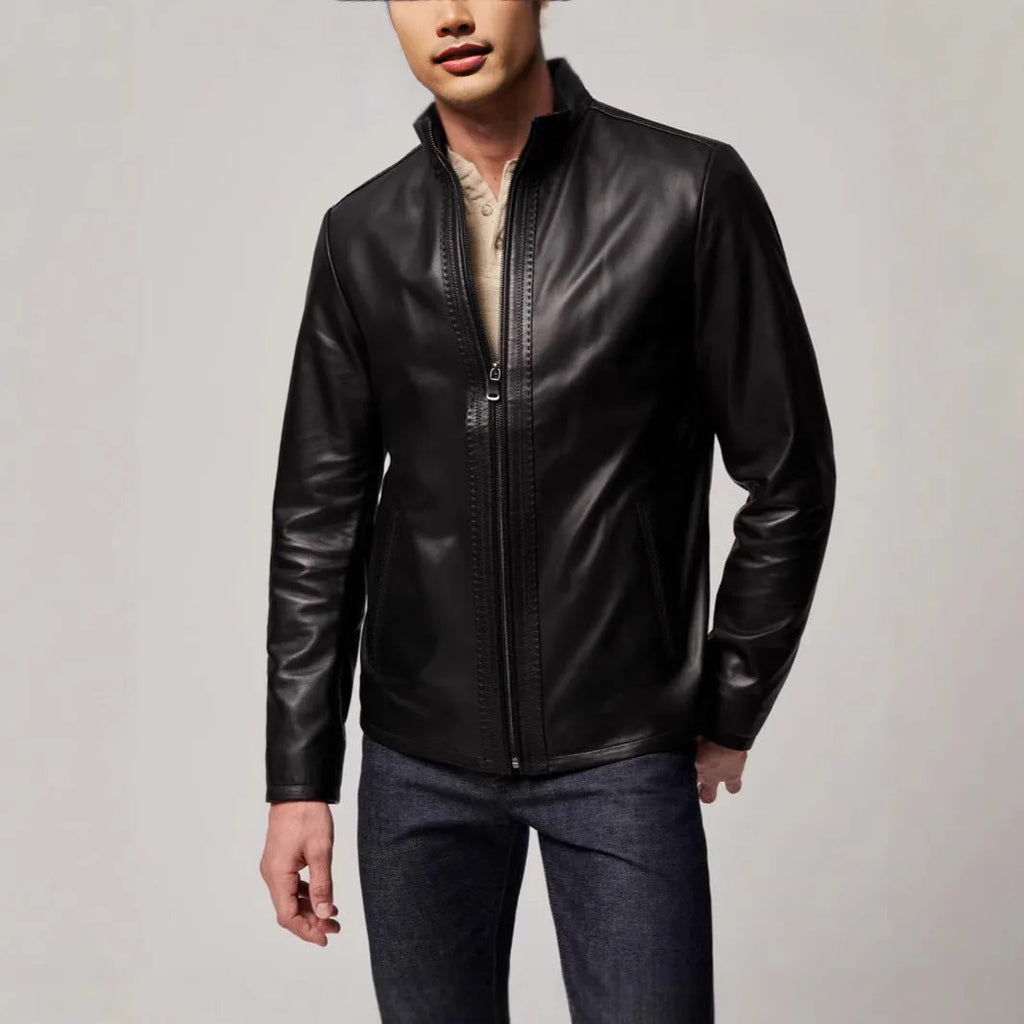 Black men's retro leather jacket with long sleeves and straight hem on a hanger