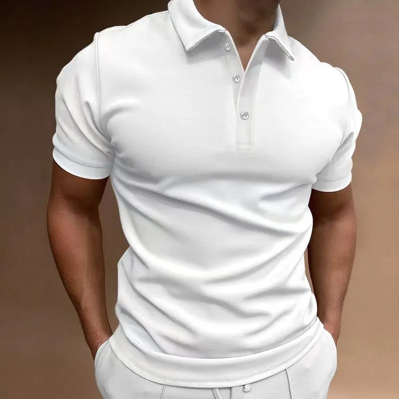 Man modelling a loose fit grey cotton blend short sleeve t-shirt.