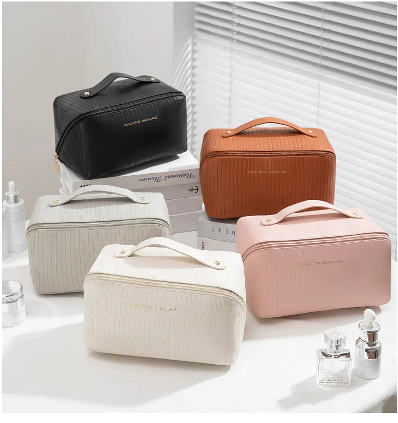 Vertical pattern pillow makeup bag in beige, black, brown, grey, or pink, showing cubic 22.5cm shape.