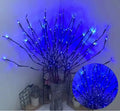 Silver branch LED decorative tree lamp with colour-changing lights in a vase base.