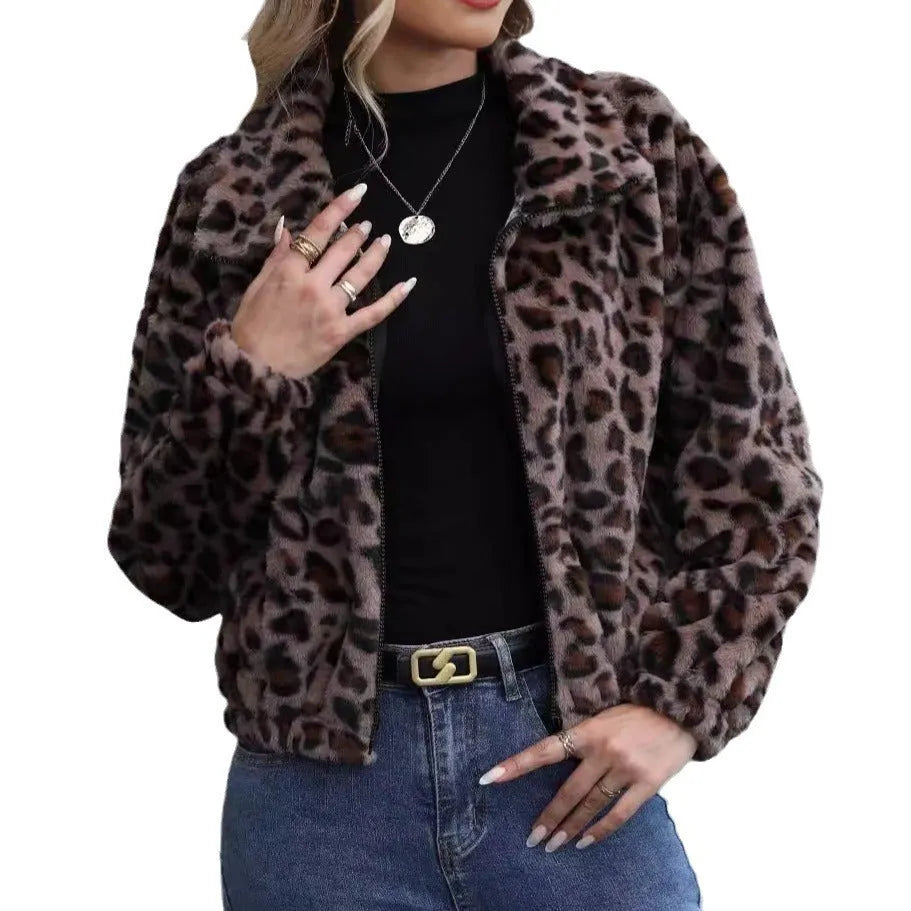 A woman's loose-fitting, zip-front plush coat in a leopard print pattern with raglan sleeves.