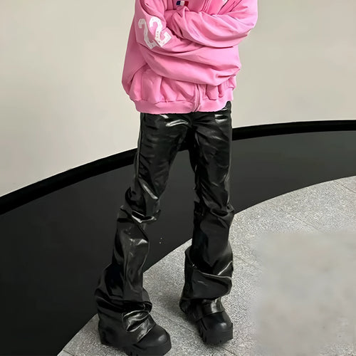 Black women's skinny jeans with a shiny patent leather coating on the denim fabric, shown in a straight-leg cut.
