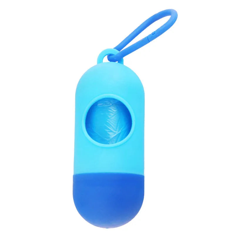 Black plastic dog poop bag dispenser with Velcro strap and a side metal hook.