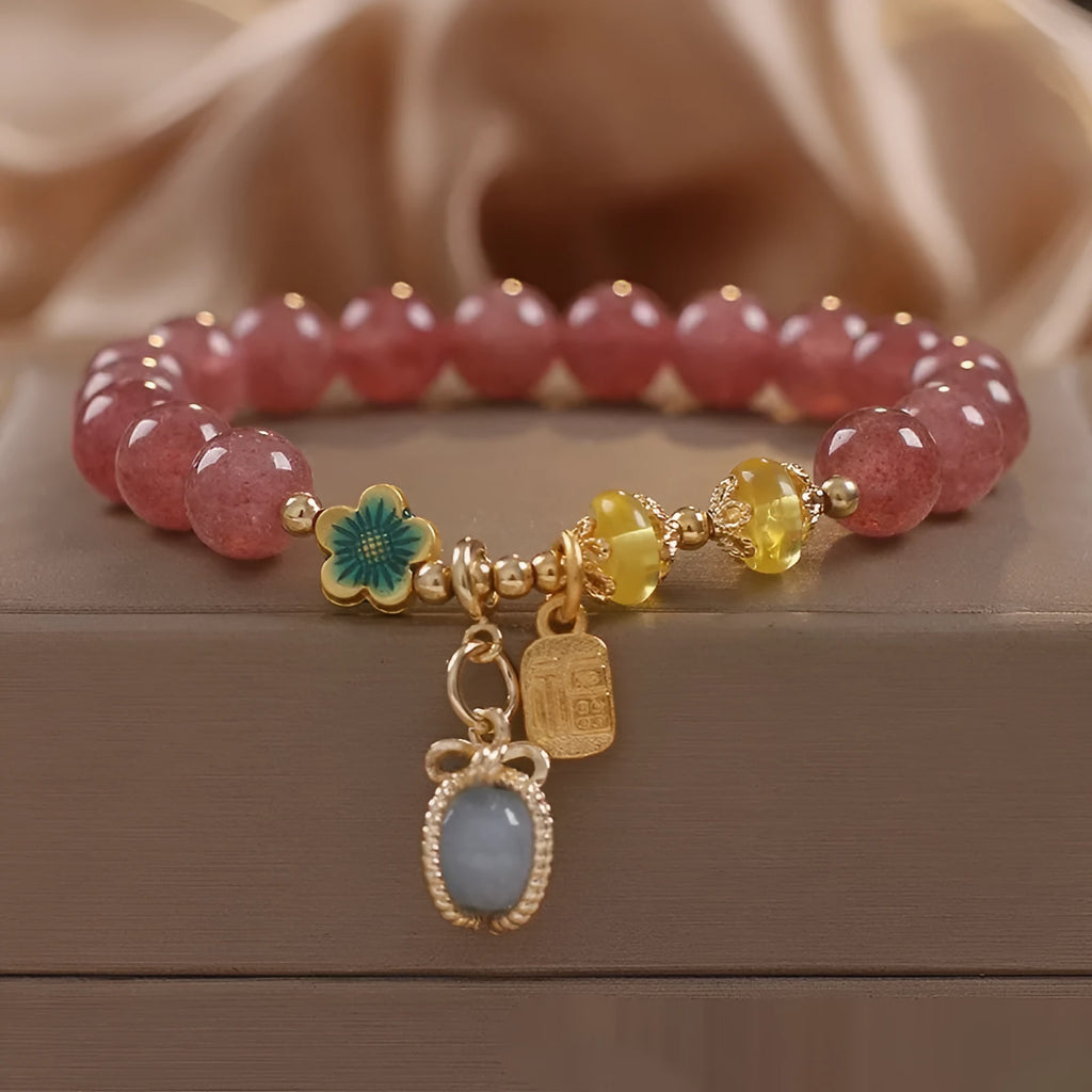 Red adjustable bracelet with strawberry quartz beads, alloy charm and rhinestone detailing
