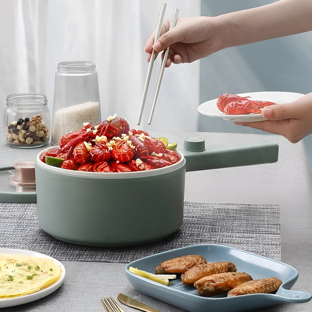 White mini electric cooking pot with 600W power and multiple cooking functions including boiling, steaming and frying