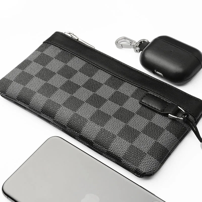 Men's black leather clutch wallet made from cowhide, showing plaid texture and open view of polyester lining.