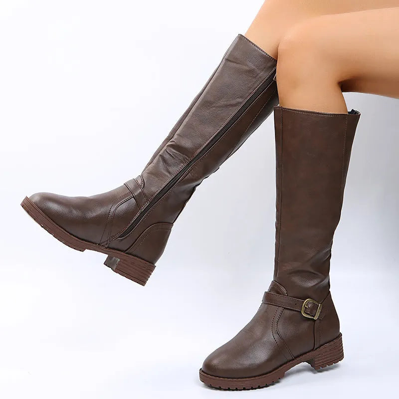 Women's black knight style ankle boots with a buckle detail on the upper and a square heel.