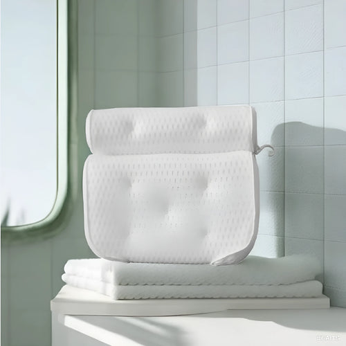 White bathtub pillow with 4D mesh and 7 suction cups on a bathtub.