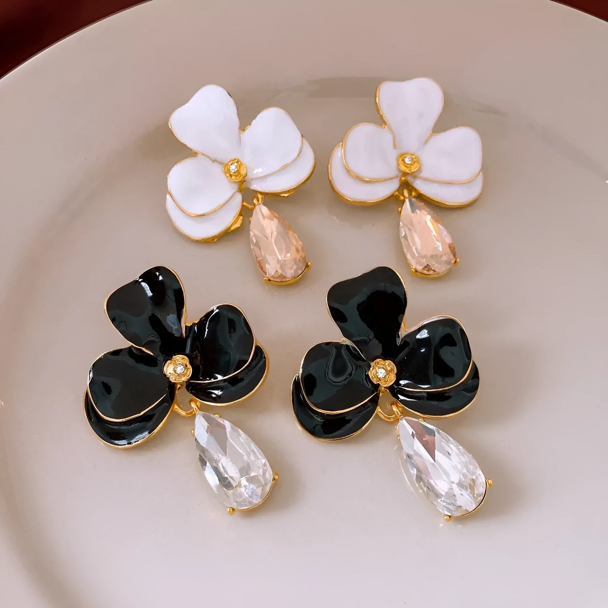 Floral pendant earrings in alloy with dripping oil finish, silver needle posts, Golden-white or Golden-black