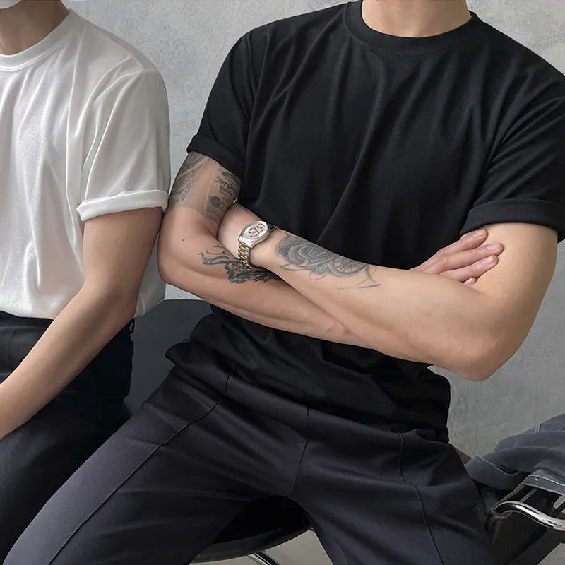 Men's slim fit cotton t-shirt in black on a hanger, showing round neck and half sleeve design.