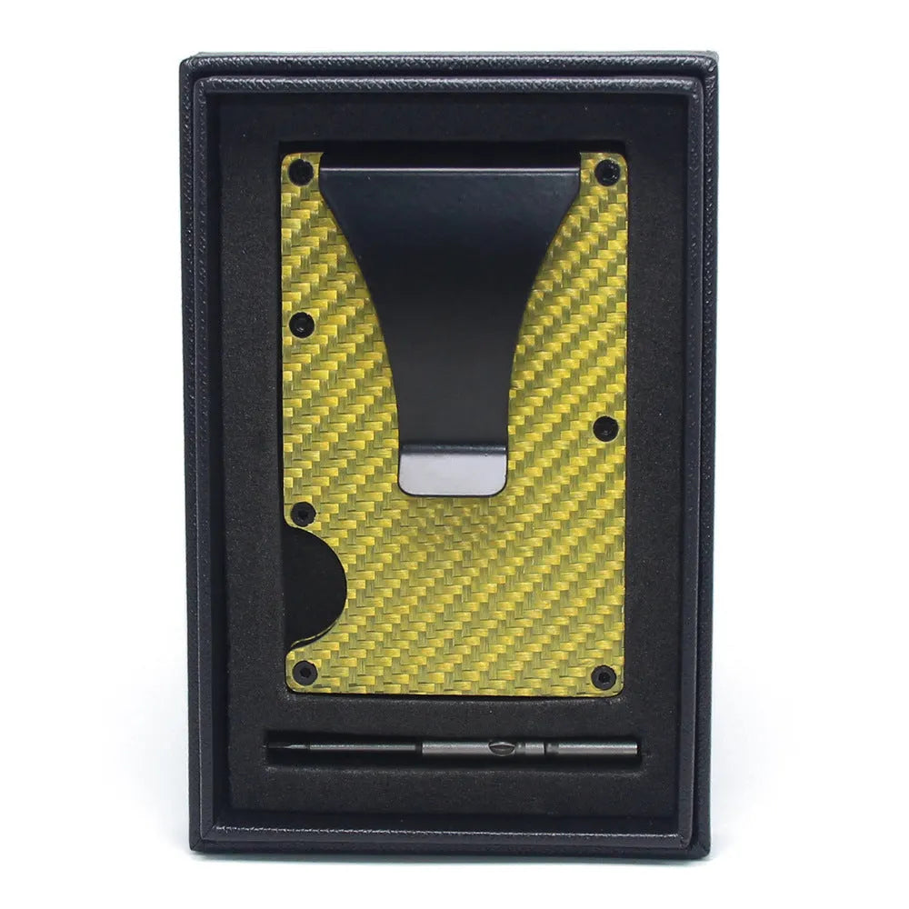 Slim black carbon fibre geometric wallet holding bank cards, showing 8mm thickness profile.