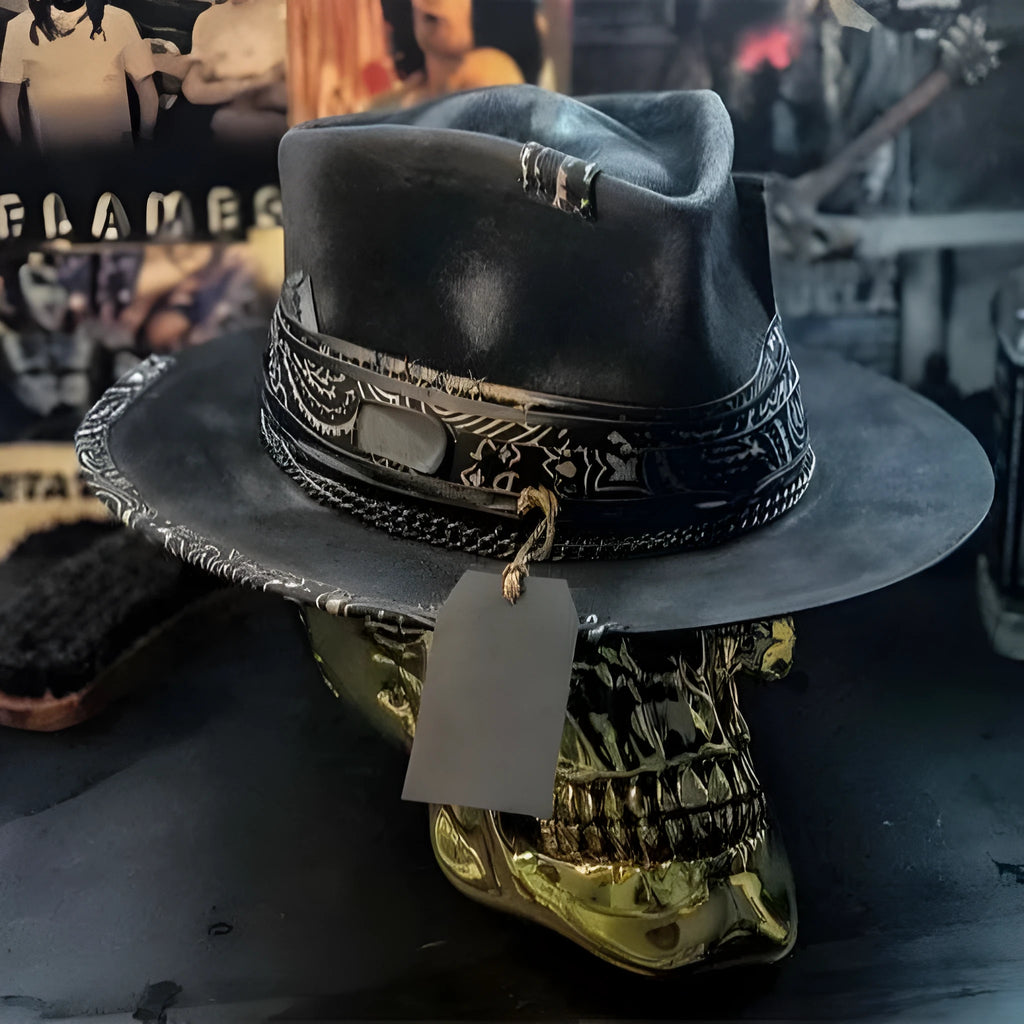 Handmade black wool felt skull hat with conical crown and textured denim-like finish.