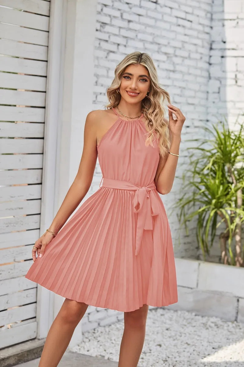 Women's black halter neck strapless sundress with a pleated chiffon skirt and an adjustable waist belt.