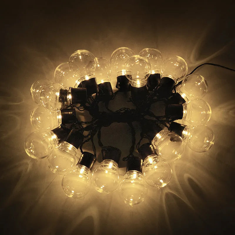 10 metre solar powered decorative festoon lights with 40 LED bulbs for festival tents in black with warm white LEDs