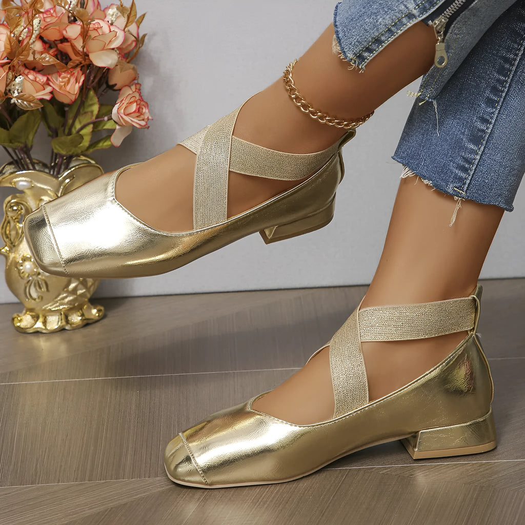 Gold women's slip-on evening pumps with skirt detail, square toe, and low rubber heel