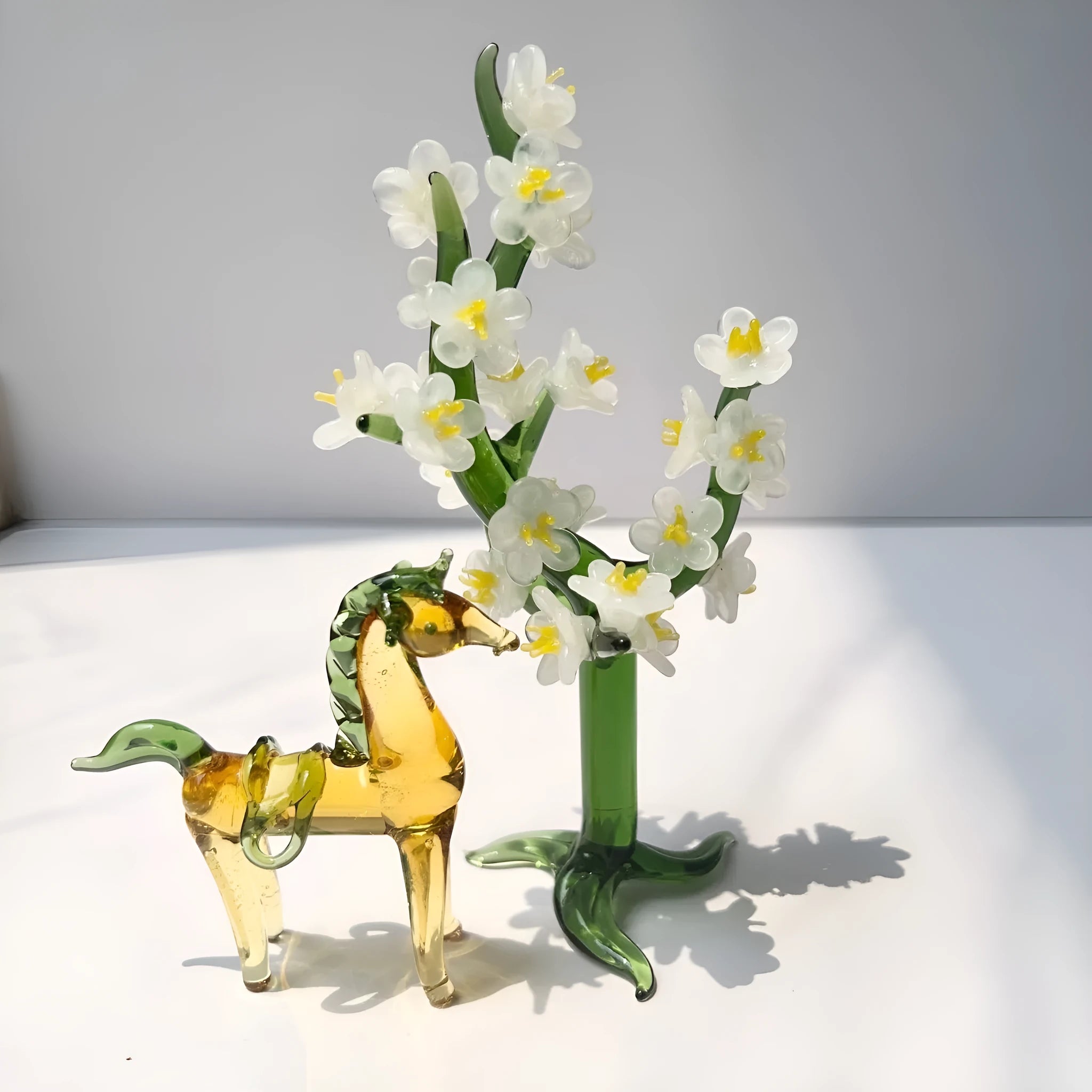 A smooth glazed horse figurine ornament in a modern minimalist style on a table.