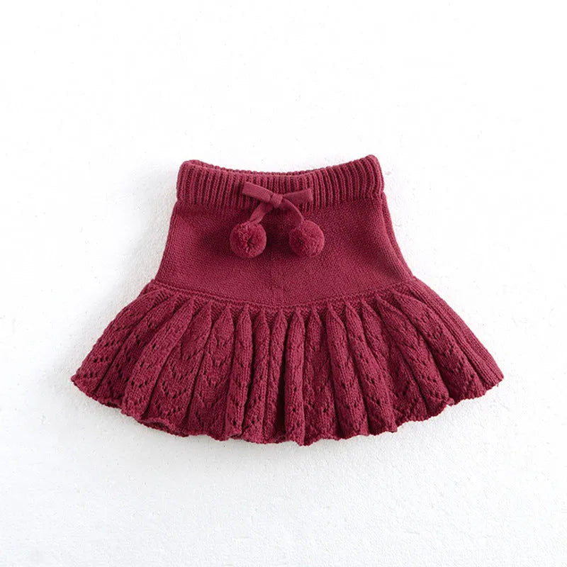Girls hollow retro pleated pantskirt in light gray purple cotton, front view, on child of about 90cm height