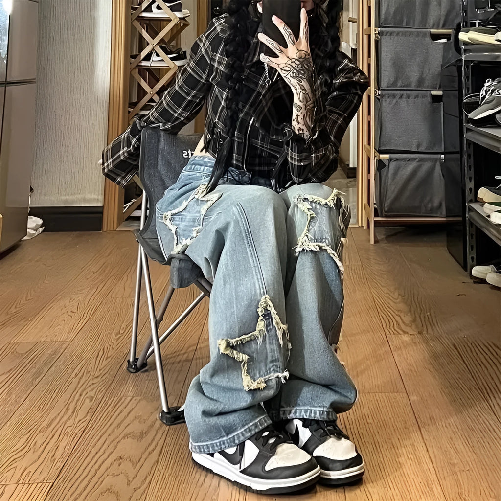 Blue women's high waist wide-leg denim jeans on a hanger, showing the straight leg cut.