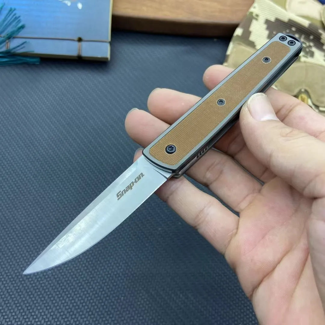 Folding fruit knife with stainless steel blade in black, brown, or red colour options showing 17cm length