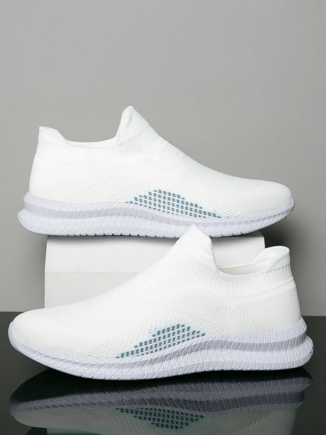 Popcorn Flyknit low-top fabric casual sneaker in solid black, blue, or white with a round toe.