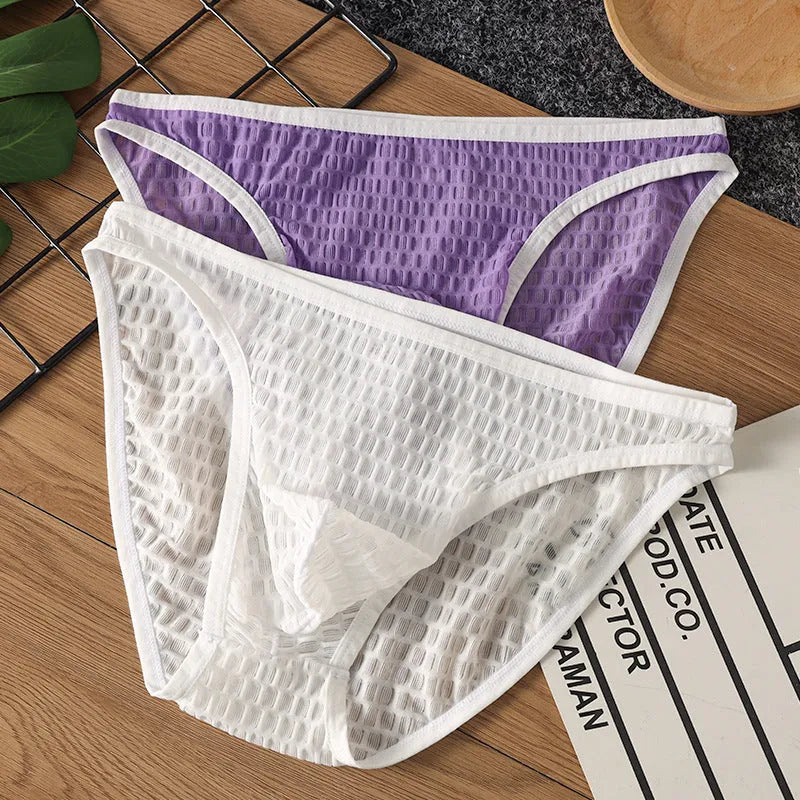 Men's low waist transparent visual lace underwear in multiple colours on a size chart