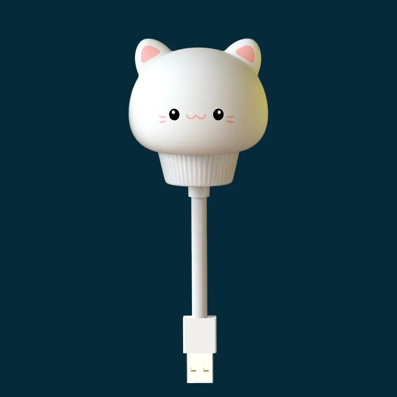 Cute cartoon animal USB night light in bear shape with remote control on a bedside table.