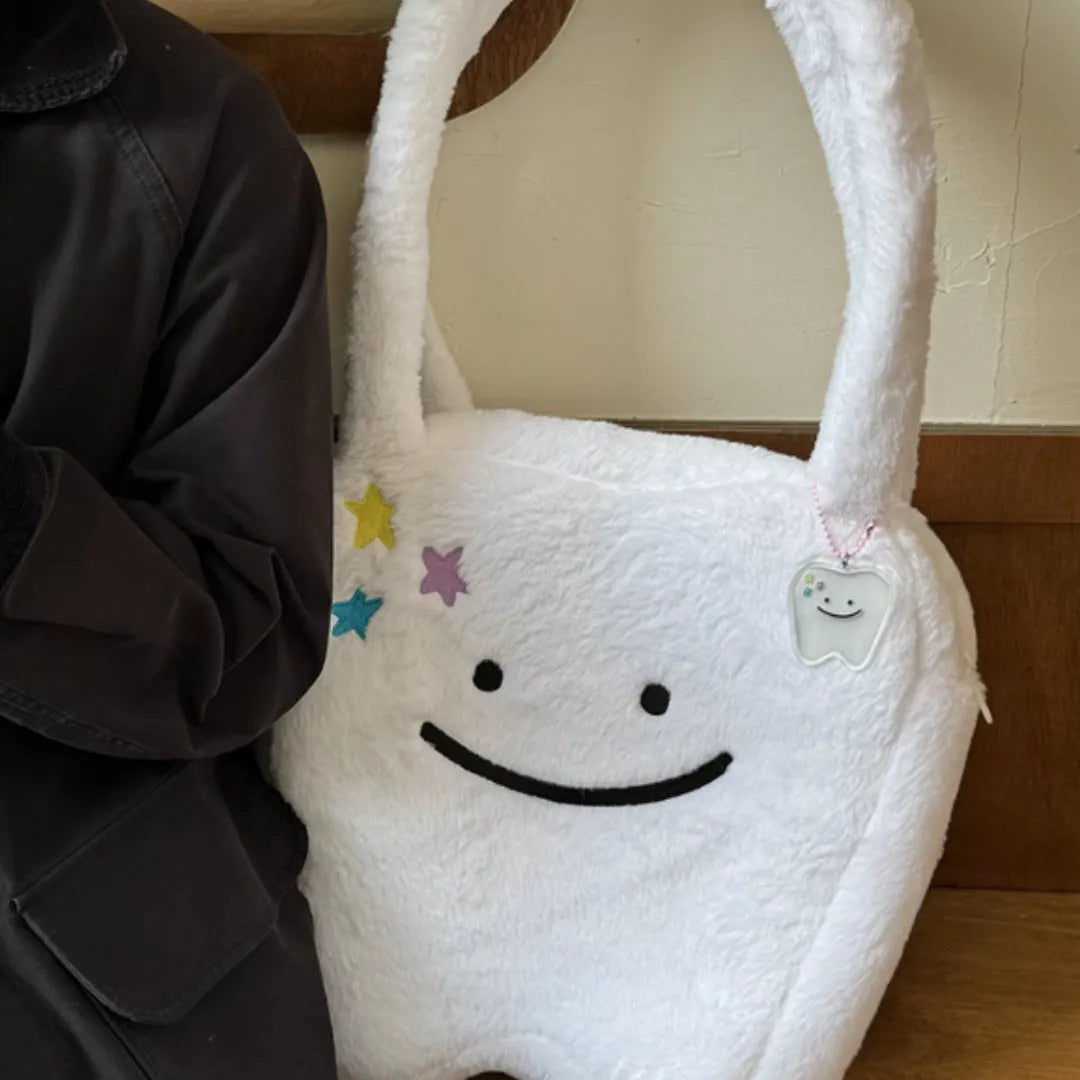 White plush large tooth design shoulder tote bag with crossbody strap and zipper opening