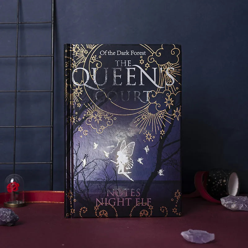 Blue luminous hardcover A5 notebook open to show full-colour Night Elves illustrated pages.