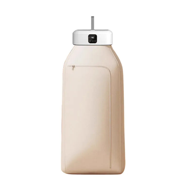 White cylindrical portable laundry drier dryer with remote control on a countertop.