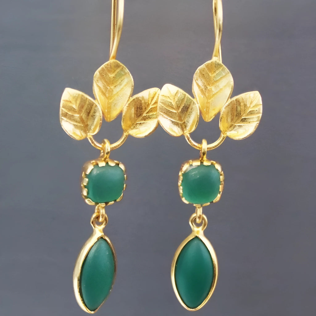 Gold-colour drop earrings with French leaf design, tassels, and small zircon stones.