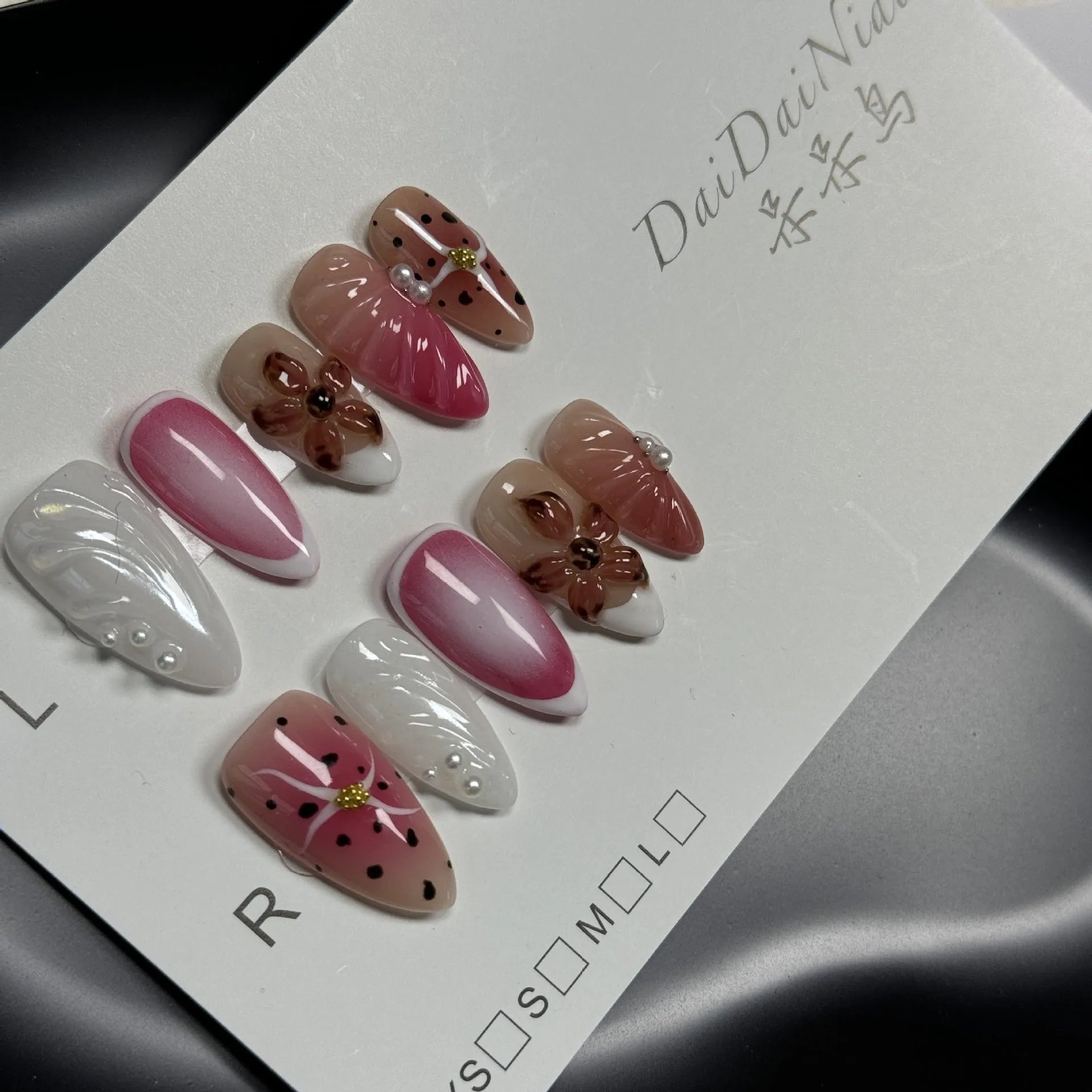 Three-dimensional hand-painted nail art stickers with embossed candy patterns in multiple colours