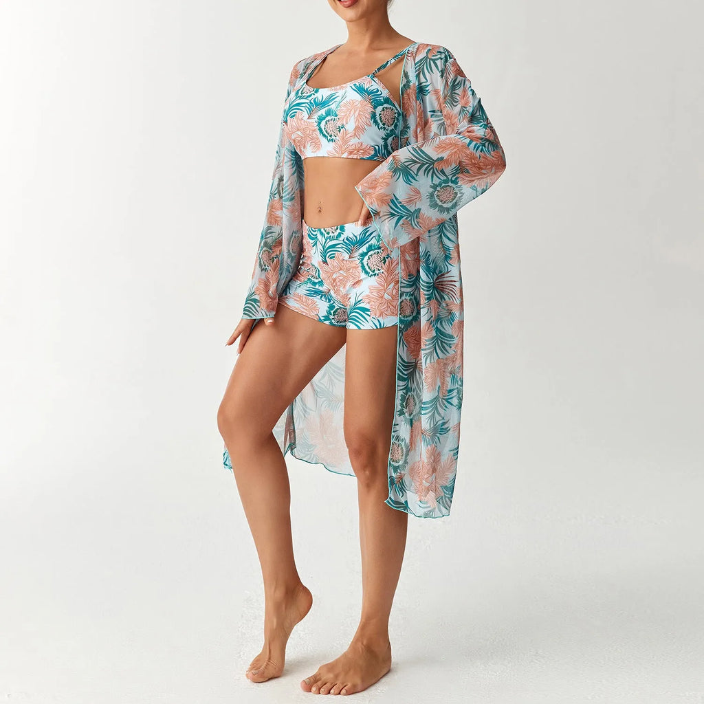 Women's three-piece swimsuit set with long sleeve blouse in pink, black, white, and sapphire blue