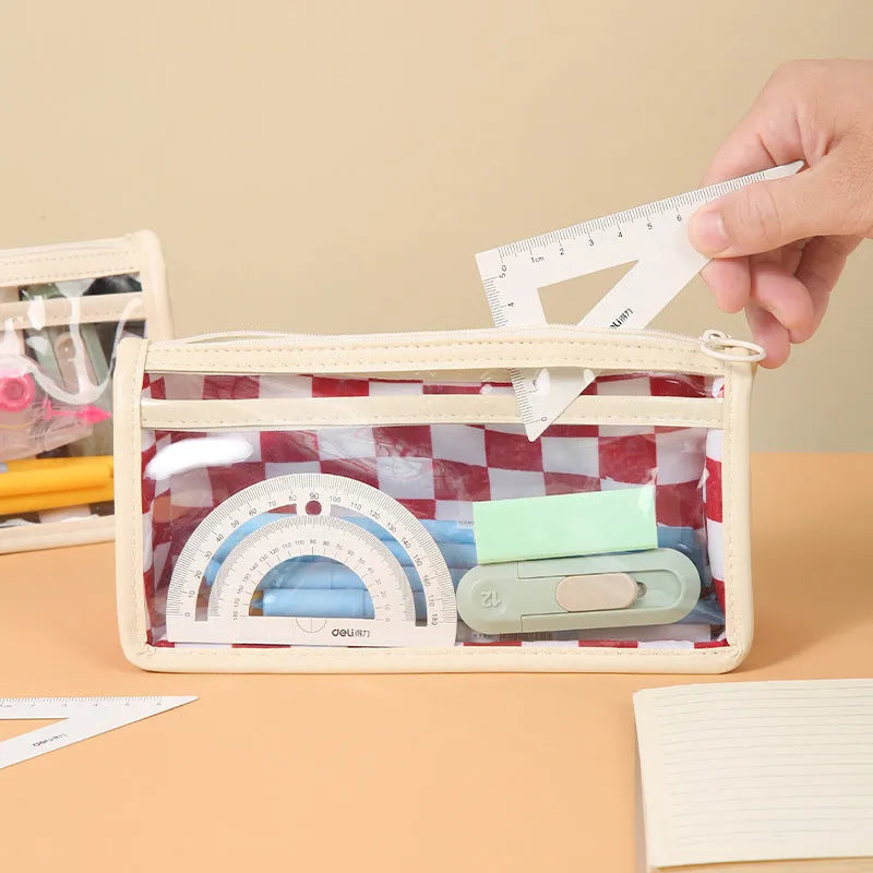 Clear PVC pencil case with black and white chessboard grid design, showing pens inside.