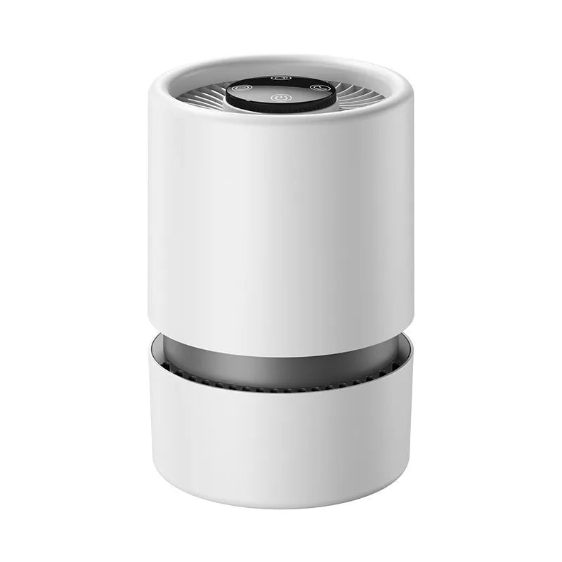 White desktop air purifier on a table with USB cable and aromatherapy tablets