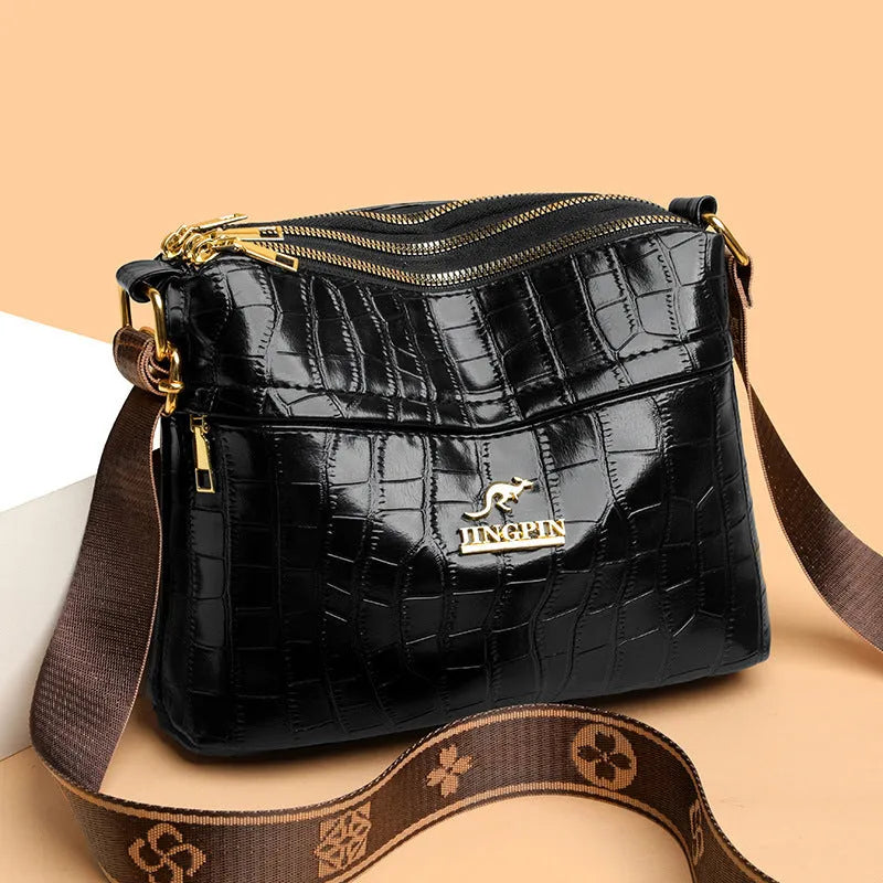 Large capacity multi compartment cross body bag in brown PU with sandwich pocket and sewing thread detail
