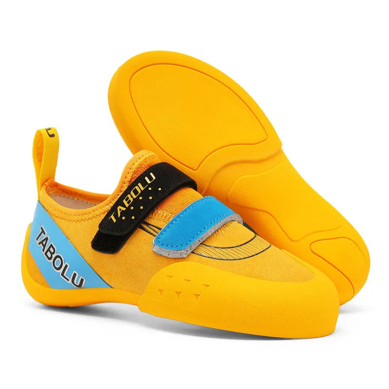 Men's and women's beginner rock climbing shoes with Velcro straps and coloured trim.