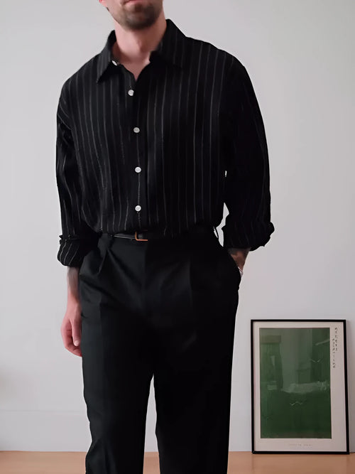 Black pinstriped button-down polyester shirt on a hanger, showing regular fit and striped pattern.