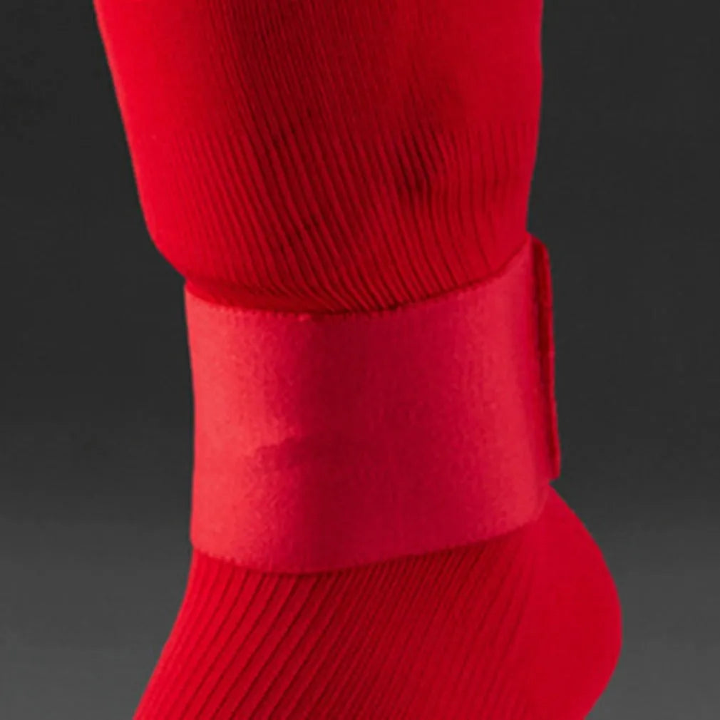Silicone rubber shin guard fixing strap in red, shown stretched
