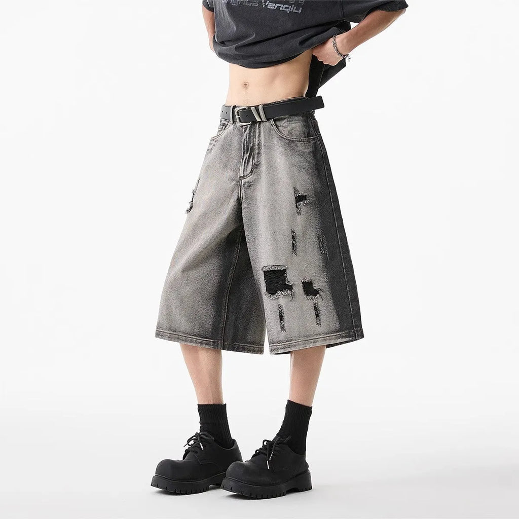 Gray water washed hole detail denim shorts with cropped length and loose fit
