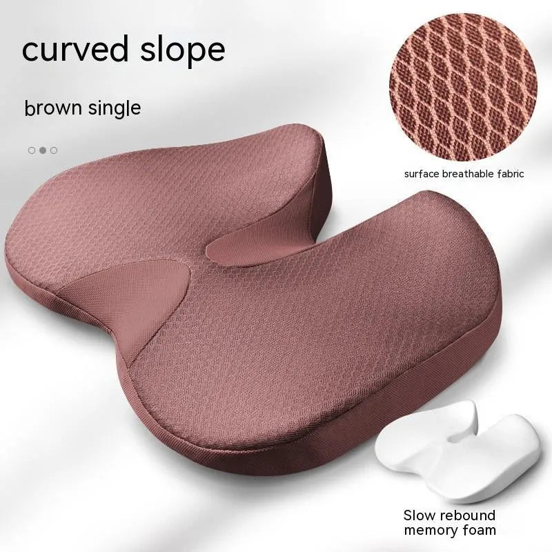 Curved wedge seat cushion for tailbone support in car, shown in beige colour with memory foam interior