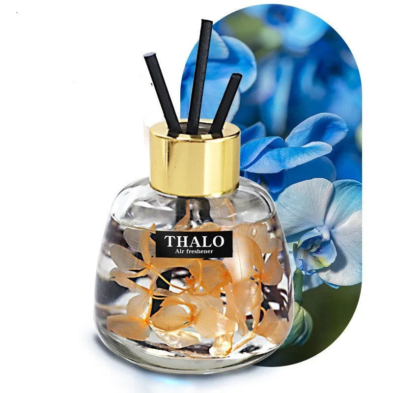 Glass bottle car perfume ornament with loose incense in decorative colours.