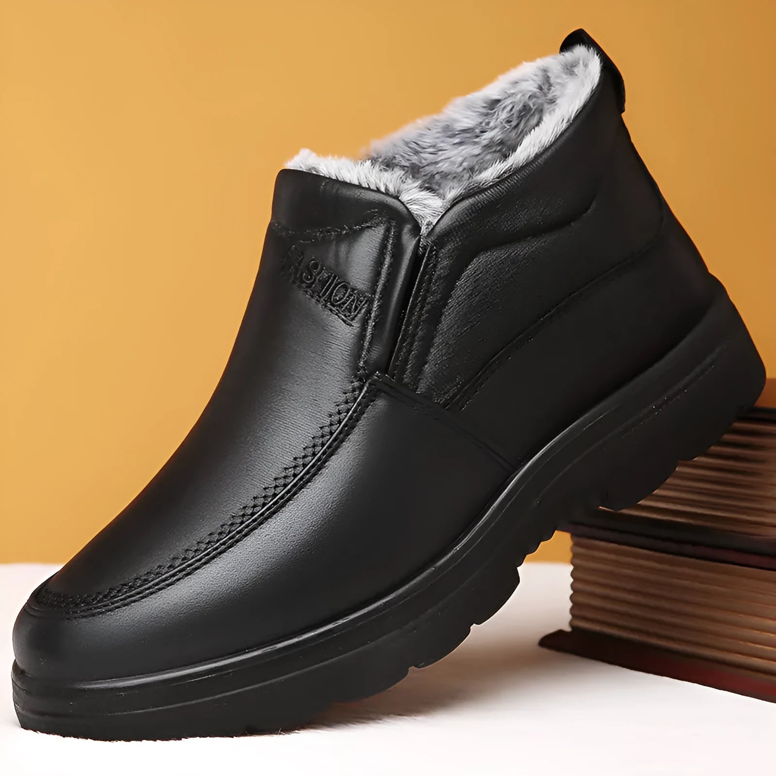 Men's black fleece-lined slip-on winter shoes with a rubber sole shown on a white background.