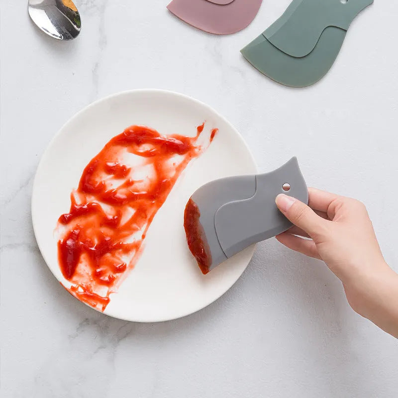 Penguin-shaped soft kitchen scraper for cleaning plates and removing food stains