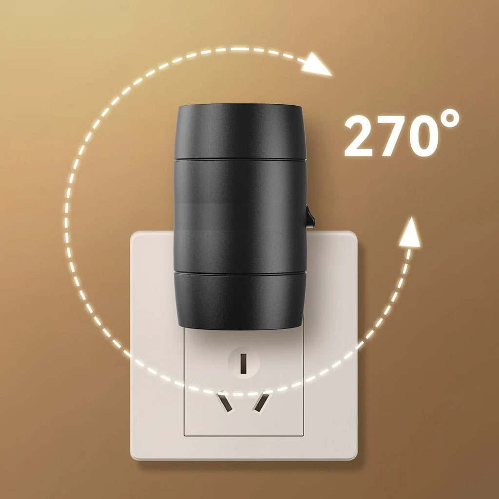 A small white plug-in night light with an adjustable head, shown next to a power socket for scale.