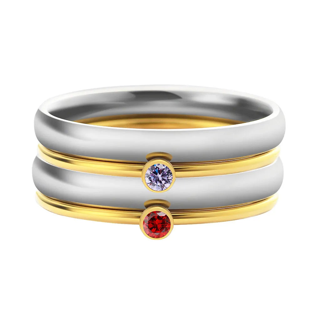 Gold-toned titanium steel engraved ring with December birthstone colour and geometric layered design.