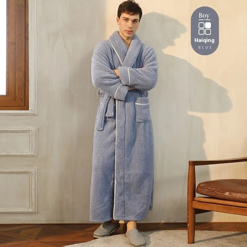 A man and woman wearing matching thick, navy blue flannel bathrobes in a European style cut.