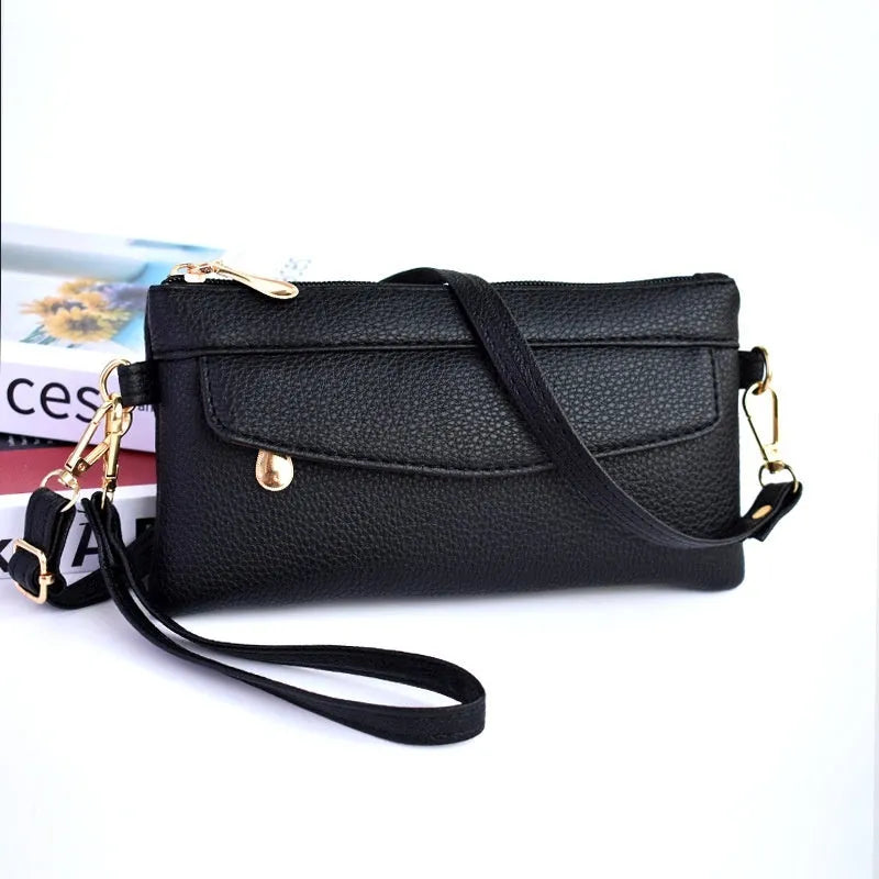 Soft PU leather crossbody bag in a square shape showing the internal sandwich zipper pocket.